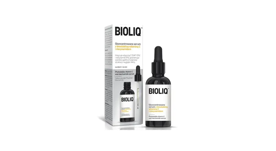 Butelka z czarnym pipetą i opakowanie z serum Bioliq z witaminą C i niacynamidem.