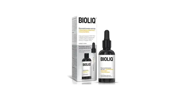 Butelka z czarnym pipetą i opakowanie z serum Bioliq z witaminą C i niacynamidem.